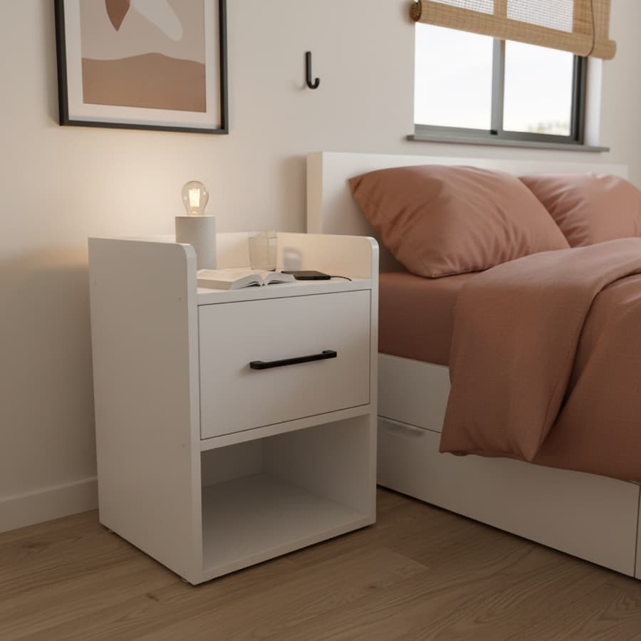 The same table beside a made bed, under a window