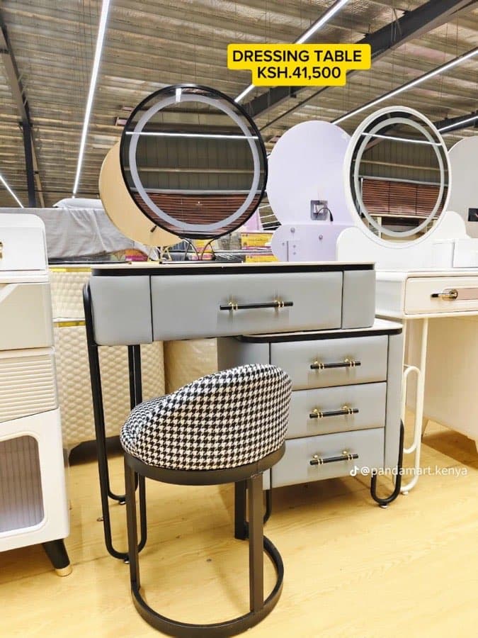 A dressing table on a shop floor, still wearing its handwritten price tag