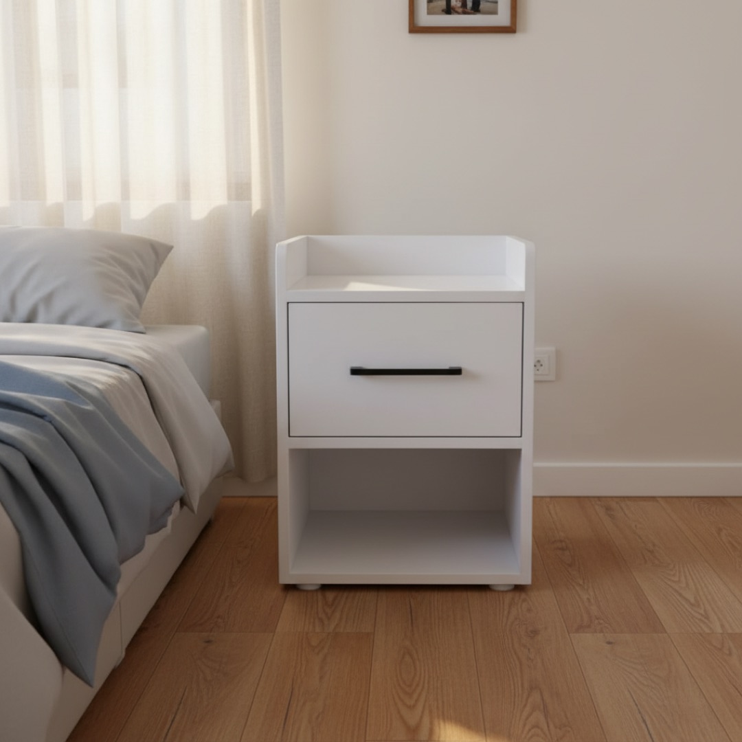 The bedside table beside a made bed